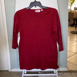 Like new red, 3/4 sleeve blouse. Rhinestone bling on sleeves